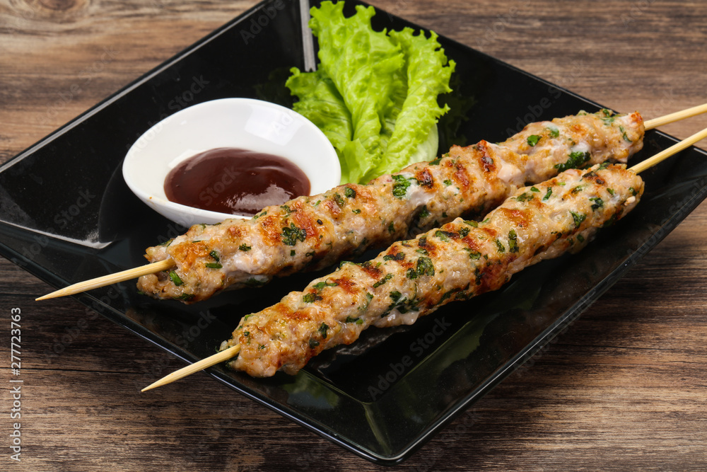 Minced pork skewer kebab with sauce Minced pork skewer kebab with sauce