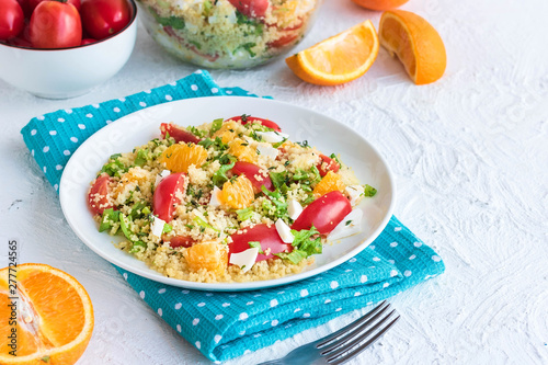 Healthy and simple food, light summer lunch, fragrant salad with couscous and oranges