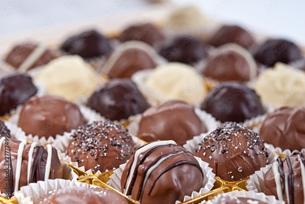 mixed white, brown and dark selfe made chocolate praline mixed white, brown and dark selfe made chocolate praline