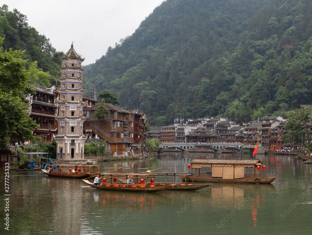 Fenghuang Old Town or Phoenix Town with the river cross through and traditional buildings, West Hunan, China. Hometown of famous novelist Shen Congwen.