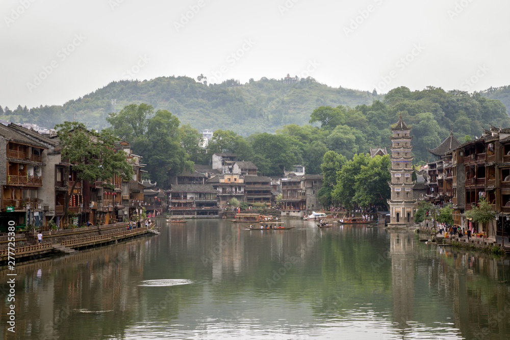 Fenghuang Old Town or Phoenix Town with the river cross through and traditional buildings, West Hunan, China. Hometown of famous novelist Shen Congwen.