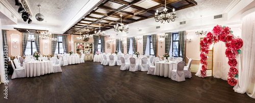 Картината върху платно Front view at an interior of a banquet hall ready for wedding