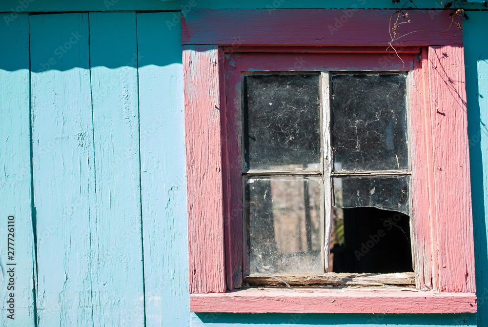 teal blue country wood building red old broken window