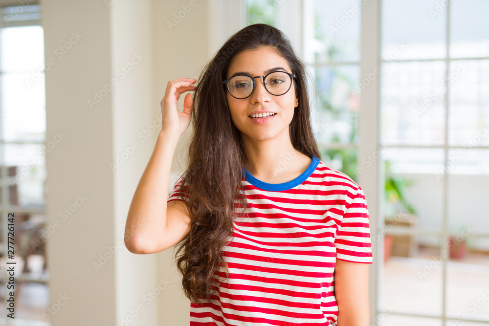 Young beautiful woman smiling cheerful wearing glasses looking happy with a big smile