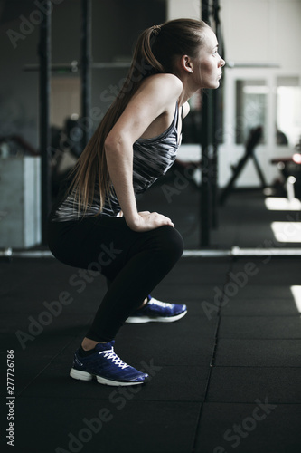 Girl warming up in the gym before training