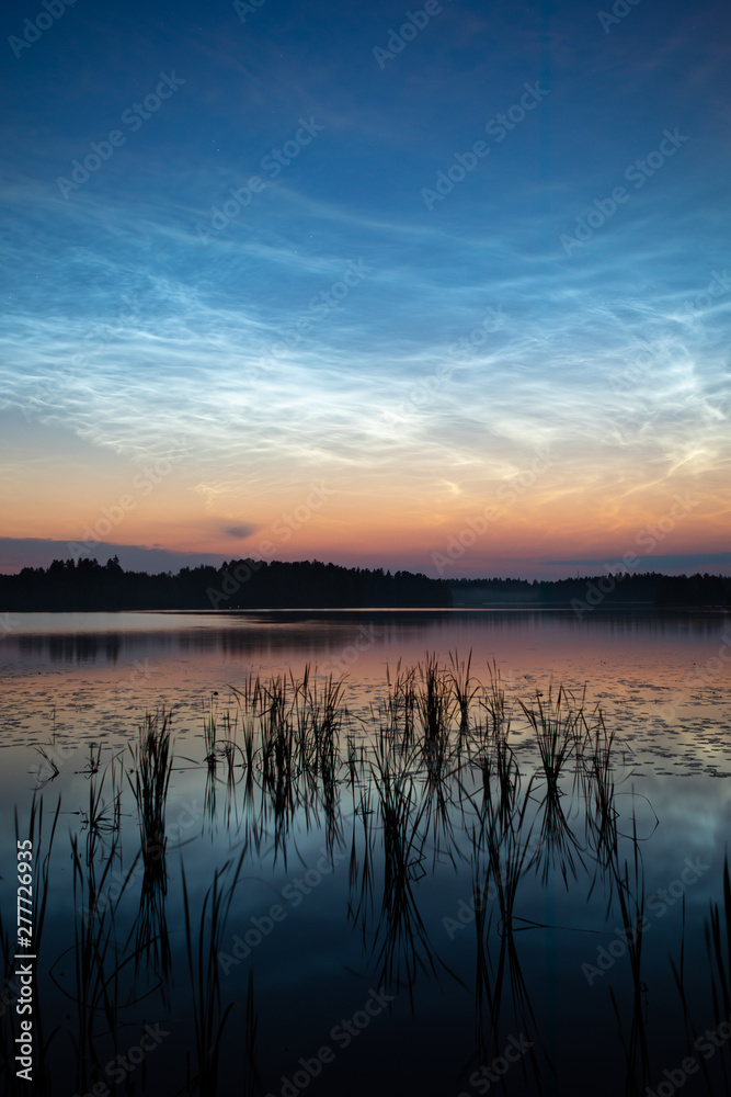 Fototapeta premium Night shining clouds over lake