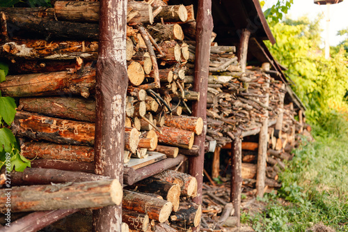 Fototapeta Naklejka Na Ścianę i Meble -  Pile of firewood. Preparation of firewood for the winter. Wooden background.
