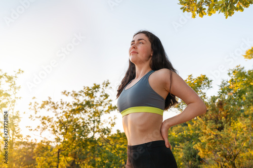 Young sports woman engaged in warm-up before sports. The concept of sport, fitness and healthy lifestyle