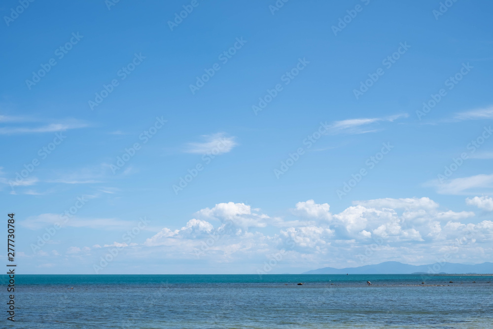 Blue Sky with White Clouds and Sea Background.