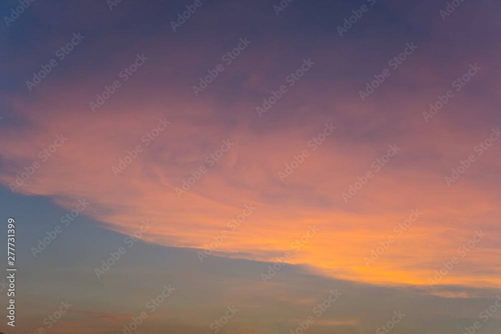 Bright blue and orange sky sunset and yellow clounds in evening day,effect reflection from the sun,texture abstract background. Bright blue and orange sky sunset and yellow clounds in evening day,effect reflection from the sun,texture abstract background.