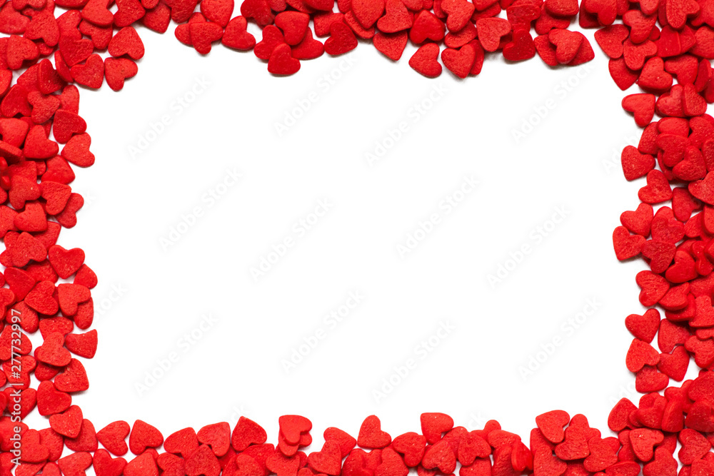 Valentines day romantic background. Decorative candy hearts on a white background Valentines day romantic background. Decorative candy hearts on a white background