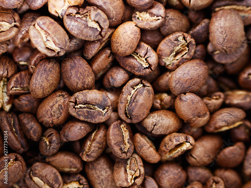 Fresh delicious organic crafted medium dark roasted Mexican arabica coffee beans background