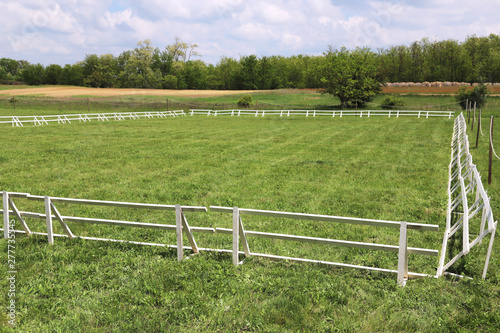 Green grass covered equestrian horse arena