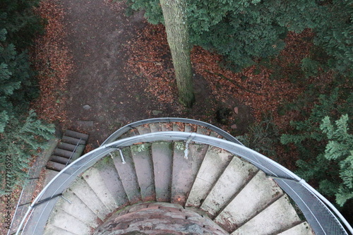 old spiral staircase in the forest