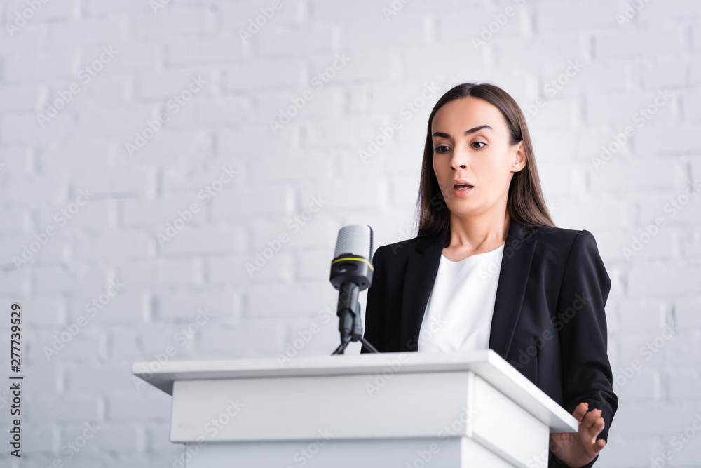 scared lecturer suffering from fear of public speaking while standing on podium tribune scared lecturer suffering from fear of public speaking while standing on podium tribune
