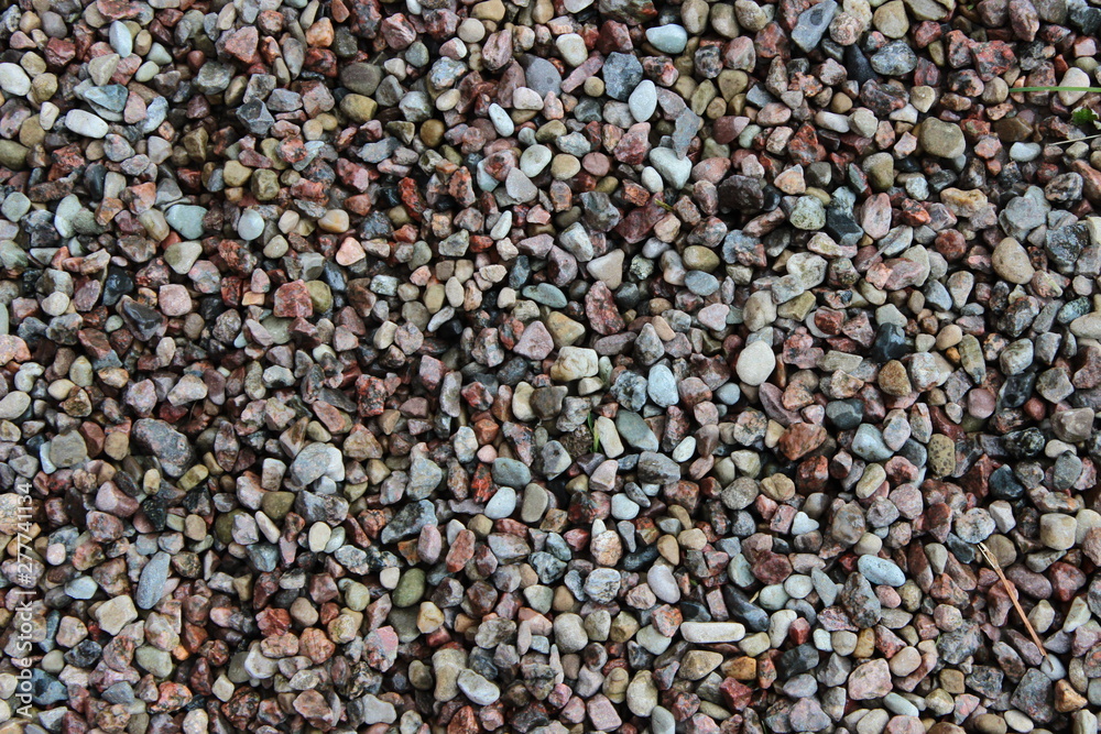 Background with small stones. Stones pattern. Texture with stones, small gravel Background with small stones. Stones pattern. Texture with stones, small gravel