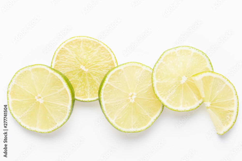 Composition with fresh ripe limes on light background, top view Composition with fresh ripe limes on light background, top view