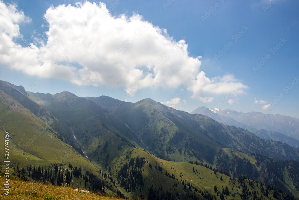 View of the mountains in the summer, Almaty, Kazakhstan. View from the mountain peak Kumbel