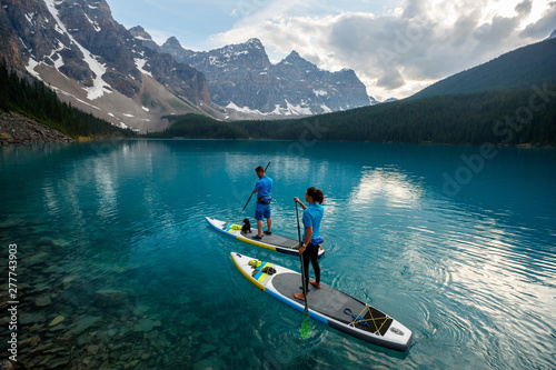 Couple paddleboarding in Moraine Lake photo