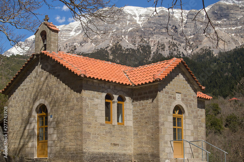Kipseli village st Panteleimon church view to the mountain Tzoumerka in winter