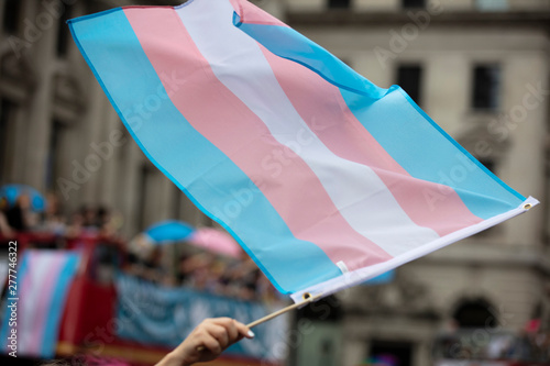 A transgender flag being waved at LGBT gay pride march photo