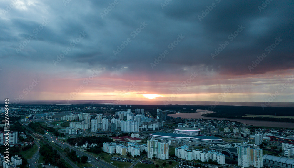 Storm clouds over the city. Crimson sunset. The City Of Minsk. Photos from the drone.
