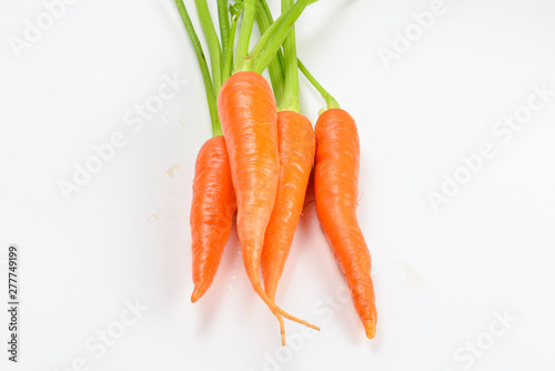Fresh orange carrot on a white background.