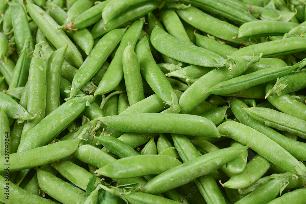 Fresh pea pods as background. Top view. Fresh pea pods as background. Top view.