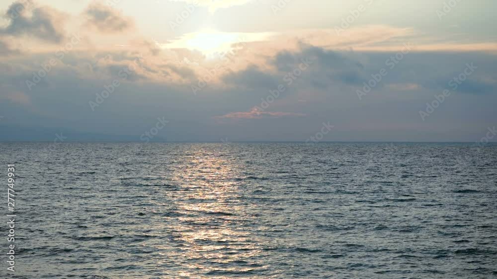 Seascape. The sun setting over the Mediterranean sea at sunset. Greece. Slow motion. HD