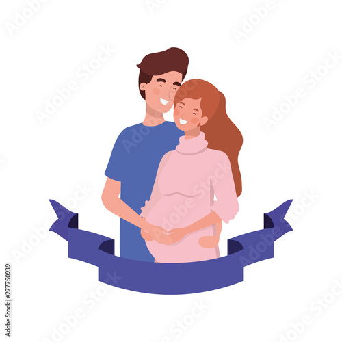 pregnant woman with husband with decorative ribbon