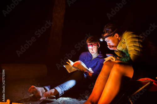 Campers confer about what routes to climb at Windy Point Campground while on a rock climbing trip in Tieton Canyon in central Washington.