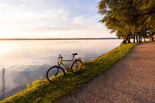 Tutzing at Lake Starnberg, Bavaria, Germany: A bike at the lake during sunrise. photo