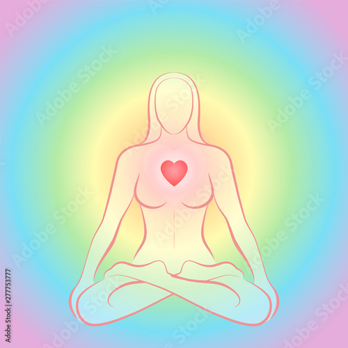 Meditating zen woman in lotus position with glowing red heart chakra on rainbow colored circular background.