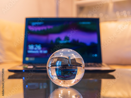 Glass ball with laptop in the living room photo