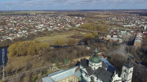 Medieval Catholic ancient castle-fortress in Berdichiv city, Ukraine. Monastery of the Barefoot Carmelites. Aerial survey, flight of drone photo