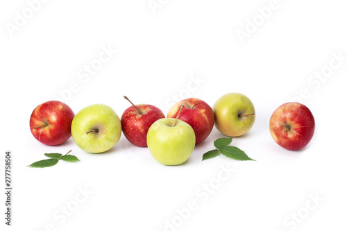 Red and green apples on a white background. Green and red juicy apples with green leaves on an isolated background. A group of ripe apples on a white background.