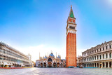 Sunrise in San Marco square with Campanile and San Marco's Basilica. Panorama of the main square of the Old town. Venice, Veneto, Italy.