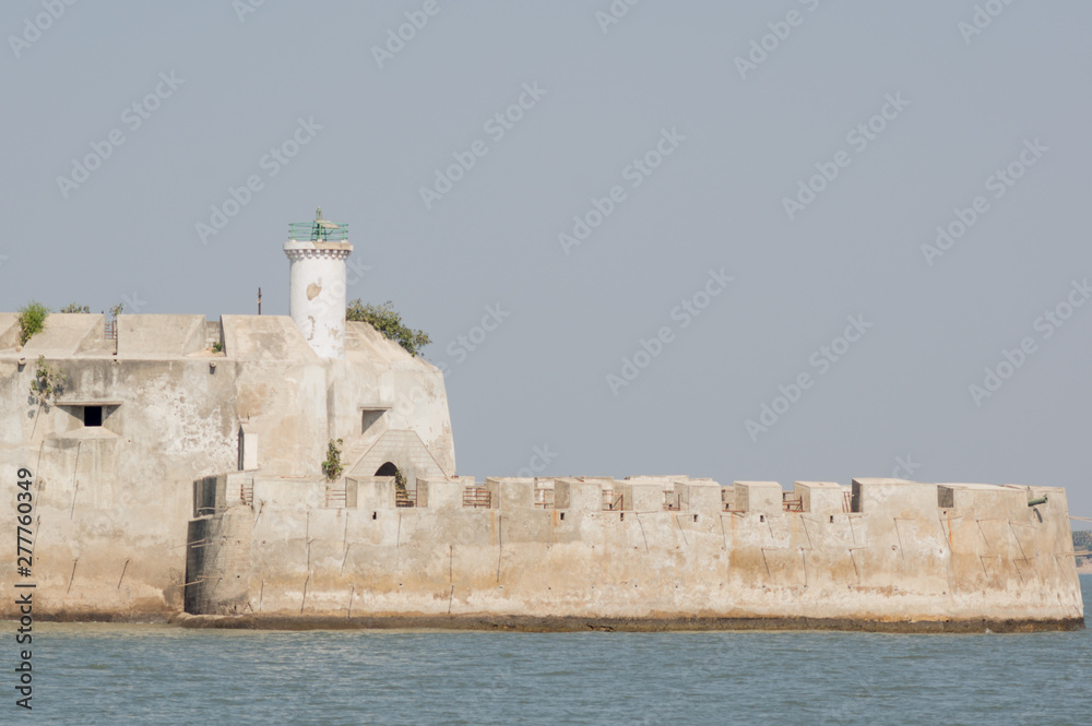 Stone building of Pani Kotha prison in the middle of the arabian sea in Diu India