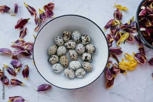 Easter food photo with quail eggs on a marble table eco farm products photo