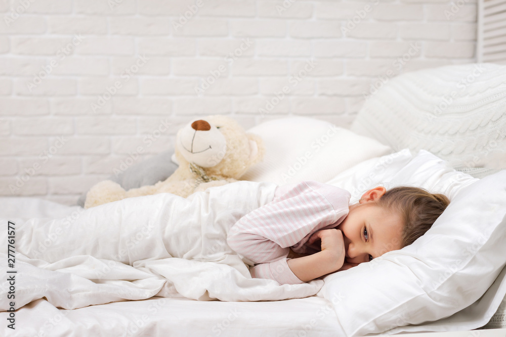 smiling little child girl sleeping in her bed smiling little child girl sleeping in her bed