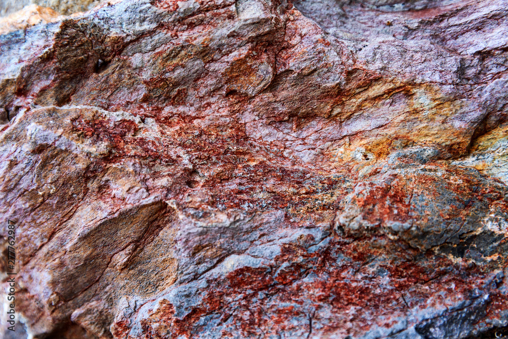 Texture of a beautiful relief natural stone. Background.