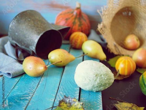 Pears  pumpkins on a wooden table  autumn season  healthy food