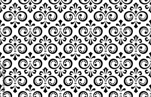 Floral pattern. Vintage wallpaper in the Baroque style. Seamless vector background. White and black ornament for fabric  wallpaper  packaging. Ornate Damask flower ornament