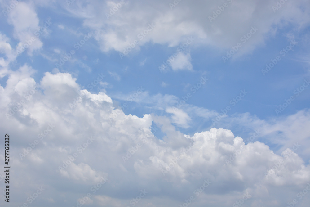 White Fluffy Clouds In The Blue Sky, For Background. White Fluffy Clouds In The Blue Sky, For Background.
