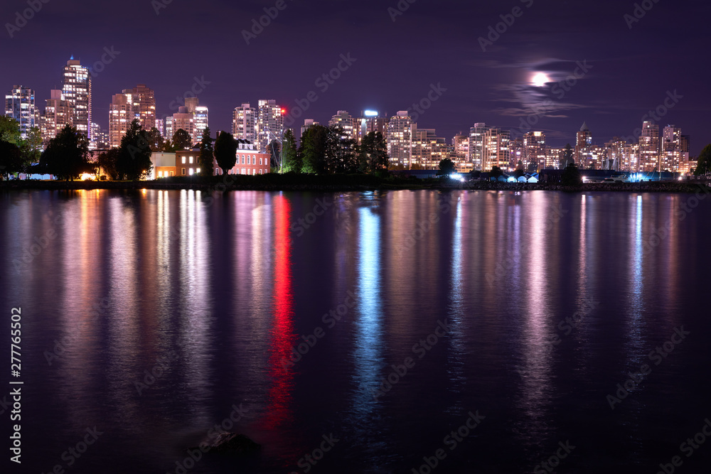 Vancouver Skyline Night Coal Harbor. The Vancouver skyline reflects in Burrard Inlet at night. British Columbia, Canada.