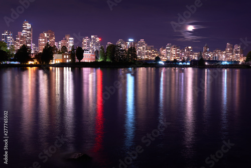 Vancouver Skyline Night Coal Harbor. The Vancouver skyline reflects in Burrard Inlet at night. British Columbia, Canada.