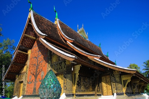 View on buddhist temple against blue sky - Wat Xieng Thong  Luang Prabang  Laos