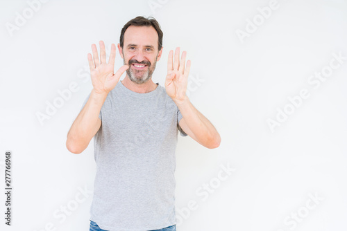 Handsome senior man over isolated background showing and pointing up with fingers number nine while smiling confident and happy.