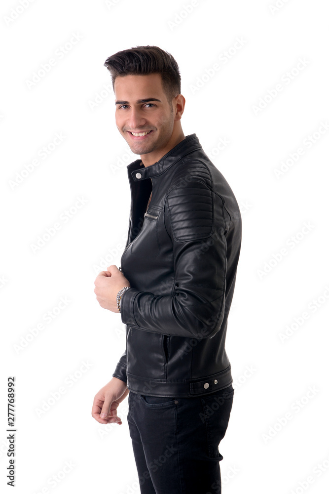 Young handsome man standing in studio shot, isolated on white, wearing black leather jacket and black jeans Young handsome man standing in studio shot, isolated on white, wearing black leather jacket and black jeans