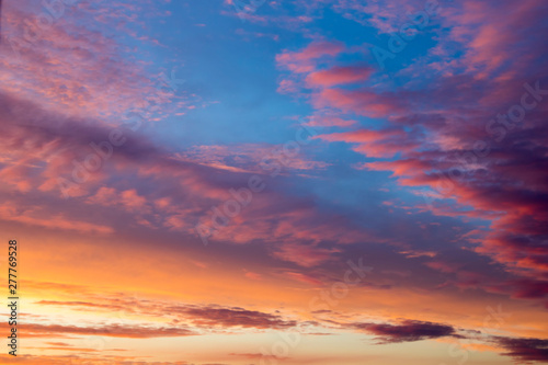 Colored clouds on sunset, amazing sky. © yauhenka